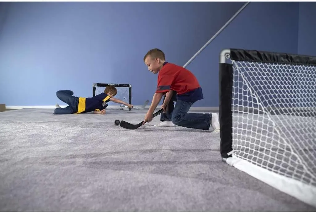 Franklin Sports NHL Kids Mini Hockey Goal Set - (2) Mini   Knee Hockey Goals, (4) Youth Sticks, (2) Goalie Sticks   (4) Foam Balls - Knee   Mini Hockey Set